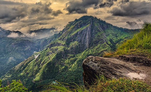 Dramatic mountain cliff-edge viewpoint and cloudscape from Ella Rock summit